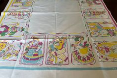 the table cloth has pictures of cartoon characters on it