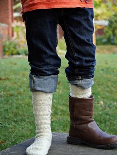 A long, warm, cozy pair of socks is everyone’s favorite once the fall winds begin to howl and this playfully textured pair in five sizes (XS/S/M/L/XL) is a delicious example. Worked from top cuff to toes, the easy to master knit/purl pattern is framed by a cable along each side. These boot socks work up speedily in a light, lofty sport weight yarn; the sporty, unisex design, flap heel, and multiple sizing make them a great gift pick Cozy Chunky Knit Socks With Round Toe, Cozy Chunky Knit Socks, Comfortable Cozy Fall Socks, Comfy Cozy Fit Socks For Fall, Warm Socks For Stocking Stuffer In Fall, Warm Comfortable Socks For Fall, Warm Comfortable Fall Socks, Casual Mid-calf Socks For Stocking Stuffer, Casual Cable Knit Knee-high Socks