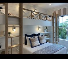 a bedroom with bunk beds and white walls