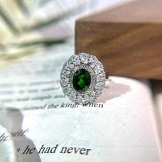 ❤ Genuine Diopside Ring Information  ❀ Dainty oval green chrome diopside  ❀ Center stone size: 6x8mm ❀ Accent stone: cubic zirconia ❀ Base metal: 925 sterling silver ❀ Band Color ❀ Gold -- 18K gold plated sterling silver ❀ Silver -- 18K white gold plated sterling silver ❀ Rose Gold -- 18K rose gold plated sterling silver ❤ Customized Top Ring  ❀ Customize Engraved: Accept name or some simple icon on ring band.  It's laser engraving, please leave the information when you order. :-) ❤ Great Package ❀ I ship all items in a dainty jewelry gift box + Jewelry Cleaning + Some small gifts. ❀ Greeting card - upon request (mark some words on the cards).   ❤ Shipping Information ❀All country is free shipping as usual.  ❀Fill in tracking number in time. ❀Require fast shipping, please click the payment Chrome Diopside Ring, Moissanite Halo Ring, Zierlicher Ring, Top Rings, White Gold Diamond Rings, Halo Diamond Ring, 14k White Gold Ring, White Gold Ring, Halo Ring