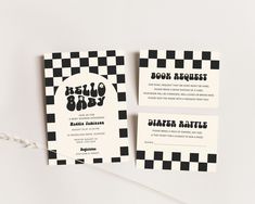 two black and white checkered business cards with the words hello baby written on them