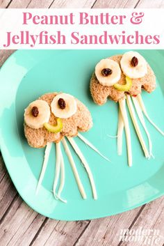 peanut butter and jellyfish sandwiches are on a blue plate with white toothpicks