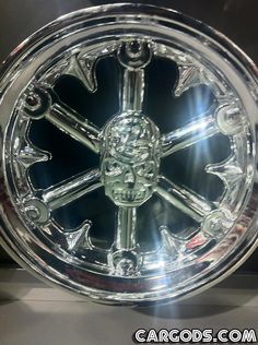 a chrome wheel with an intricate design on it