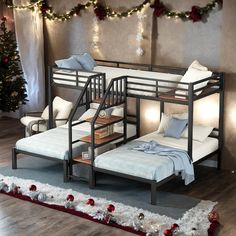 a bunk bed sitting next to a christmas tree with lights on the top and below it