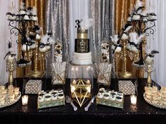 a table topped with lots of cakes and desserts covered in gold sequins