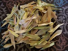 dried yellow leaves on a black and blue table cloth