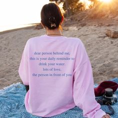 Dear Person Behind Me. Drink Your Water. If you love the vibe and aesthetic of oversized sweatshirts then this trendy crewneck is just what you are looking for. ✦ Gildan brand ✦ Unisex Adult Sizing ✦ 50% Cotton/50% Polyester ✦ DTG (Direct To Garment) printing where the ink is printed directly into the fabric. ✦ Mockups are used for demonstration purposes only. The design is printed directly on the garment and the final product may vary slightly in color and placement (due to handmade printing and differences in lighting on monitors/mobile screens). ~SIZING~ ✦ Please reference the sizing chart listed in the photos before purchasing. Size down if you want a more fitted look. If you want an oversized fit, please order 1-2 sizes up. ✦ Measure your favorite shirt armpit to armpit and top to bot Aesthetic Crewneck, Dear Person Behind Me, Preppy Sweatshirts, Trendy Crewneck, Sweatshirt Aesthetic, Sweatshirt Trendy, Christian Sweatshirt, Vsco Girl, Let Your Light Shine