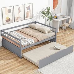 a bed sitting on top of a hard wood floor