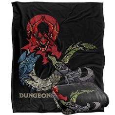 two black dragon bedspreads with red and green designs on the front, one is