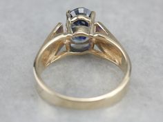 "This modern yellow gold ring has an excellent sense of structure. Well, proportioned prongs rise from the center, holding a bright blue, oval cut sapphire securely in the center. This piece would stack well with other rings and is substantial enough to wear alone as an engagement or cocktail piece! Metal: 14K Yellow Gold Gem: Sapphire 2.26 Carats Gem Measurements: 5.8 x 8.4 mm, Oval Ring Size: 7 Marks: \"T&C 14K\" Stamped on the inside band SKU #: FTZX4LE2 Each piece has been identified and Modern Yellow Gold Sapphire Ring With Center Stone, Modern Yellow Gold Sapphire Ring With Prong Setting, Modern Oval Sapphire Ring With Accent Stones, Modern Oval Sapphire Ring With Prong Setting, Modern Sapphire Ring, Sapphire Solitaire Ring, Right Hand Ring, Ring Sapphire, Sapphire Solitaire