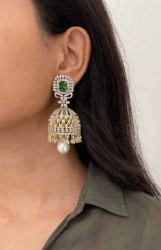 Gorgeous CZ Jhumka earrings with Emerald green stones and AAA quality CZ Korean stones  Lightweight and elegant Can be pad with any dress Length approx 2 inches Closure  Push back Please let me know if you have any questions Customized orders takes 3 to 4 weeks, depending on piece requirements. The Ombre Designs Jewelry pieces can be customized in accordance with your requirement. Please Email or Whats app on : +91 8448833193 / sonalikamehra [!at] theombredesigns.com Bollywood Green Bridal Earrings For Reception, Green Meenakari Bridal Earrings For Reception, Green Bridal Earrings For Reception On Diwali, Green Bridal Earrings For Reception During Diwali, Green Bridal Earrings For Reception At Diwali, Green Bridal Earrings For Reception And Festivals, Green Bollywood Chandbalis For Reception, Green Chandbalis For Diwali Reception, Green Chandbalis For Reception And Diwali