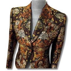 Elevate your wardrobe with this rare Richard Tyler brocade blazer, a stunning silk gold jacquard piece that radiates luxury and sophistication. Perfect for making a statement at any event, this vintage designer blazer is not just a garment but a true reflection of timeless elegance--grab yours today and let your style shine! Rare Find! Beautiful silk metallic brocade blazer by designer Richard Tyler 'Collection' Brown and gold silk jacquard blazer Shoulders are lightly padded, the sleeves are fi Formal Silk Blazer With Floral Print, Luxury Jacquard Blazer For Evening, Luxury Jacquard Evening Blazer, Jacquard Long Sleeve Blazer For Parties, Jacquard Long Sleeve Party Blazer, Jacquard Party Blazer, Fitted Silk Blazer With Floral Print, Evening Jacquard Fitted Blazer, Fitted Jacquard Blazer With Long Sleeves