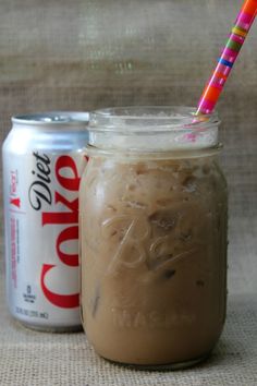 there is a drink in a mason jar with a straw