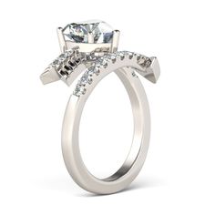 a white gold engagement ring with three stones on the side