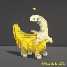 a lego model of a dinosaur made out of yellow and white blocks