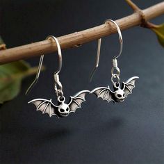 Spooky Designer Dangle Halloween Bats Hook Earrings , Dainty 925 Sterling Silver Antique Artisan Handmade Earrings Elevate your Halloween style with our Spooky Designer Dangle Halloween Bats Hook Earrings. These dainty, antique artisan handmade earrings are crafted from 925 sterling silver, offering a perfect blend of elegance and spooky charm. The intricate design features delicate bats, making them an ideal accessory for any Halloween enthusiast. Their lightweight, dangle style ensures comfortable wear, while the high-quality sterling silver guarantees durability. Embrace the spirit of the season with these unique, spooky designer earrings, perfect for adding a touch of haunted sophistication to your ensemble. NOTE:- At ModernJewelryTrunk, We pride ourselves on offering a diverse array o Gothic Sterling Silver Jewelry For Parties, Elegant Silver Halloween Jewelry, Handmade Sterling Silver Halloween Earrings, Handmade Gothic Sterling Silver Earrings, Unique Nickel-free Jewelry For Halloween, Sterling Silver Jewelry For Halloween Party, Gothic Sterling Silver Jewelry For Halloween, Handmade Dangle Halloween Jewelry, Gothic Sterling Silver Adjustable Earrings