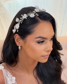 An elegant and feminine piece, this bridal hair vine is the perfect finishing touch for your wedding day look. A crystal vine base elevated with stunning porcelain flower details, this is sure to be an eye-catcher. Wear it in the front of your hair as a headband, framing an updo, or many other ways. -Genuine crystals -Porcelain flowers -Approximately 1.5in at widest point x 12.3in long (3.8cm x 31.2cm) -Rhodium plated, non tarnish finish for brilliance -Light and flexible for easy styling Shown Engagement Look, Bridal Hair Vine, Blossom Design, Romantic Flowers, Porcelain Flowers, Flowering Vines, Floral Vine, Hair Vine, Bridal Hair