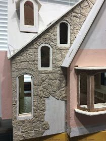 a doll house made out of fake stone