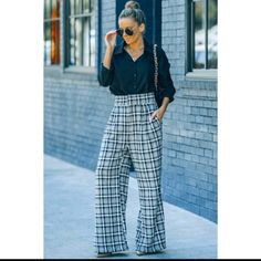 *Pattern Type: Plaid: Black, Camel, Brown, White, And Blue *Style: Casual, Business Casual, Work, Office, Career Trousers *Features *Length *Materials *Body *Imported *Product Measurements S Hip 42 In, Inseam 28 In, Waist 27 In, Outseam 42 In. Chic Plaid Wide Leg Pants, Trendy Plaid Bottoms For Day Out, Chic High-waisted Plaid Pants, Elegant Plaid Pants For Spring, Plaid High Waist Wide Leg Pants, Chic Plaid Bottoms For Business Casual, Plaid High Waist Bottoms For Day Out, Casual Plaid Wide Leg Pants, Chic Plaid Bottoms For Day Out