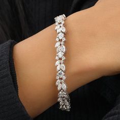 This beautiful bracelet is made with the highest quality diamond on a 100% guaranteed 14k solid gold setting and the best quality moissanite The bracelet features diamonds weighing 12.34 carats. ★ MATERIALS ★ ♥ Stone: Moissanite Shape: Round Carat: 5.38 Clarity : SI Color: HI ♥ Stone: Moissanite Shape: Marquise Carat: 6.96 Clarity : SI Color: HI THE METAL 14K Solid Gold Available in Rose / Yellow / White Gold MADE TO ORDER Good things come to those who wait! Please allow 2 weeks for your p Big Diamonds, Jewelry Board, Bracelet Diamond, Design Bracelet, Leaves Design, Jewelry Boards, Rose Yellow, Diamond Carat, Tennis Bracelet Diamond