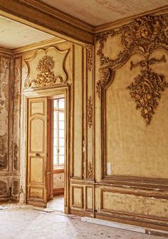 an ornately decorated room with wooden doors