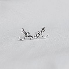 Real 925 Sterling Silver Dainty Tiny Dragonfly Stud Earrings These lovely earrings can be used in Earlobe and Multiple Piercings. Measures 11.5 x 7.5 mm Comes with pushback backings Jewelry will come in a gift box * Please read shop policy before placing an order * *JEWELRY CARE* Sterling Silver will tarnish over time, but to help keep your jewelry looking beautiful - Clean with a soft dry cloth after wear and store inside an airtight bag or container. Remember to remove your jewelry when: * App Dainty Silver Hypoallergenic Ear Climbers, Silver Ear Climbers As A Gift, Delicate Silver Ear Climbers For Gift, Sterling Silver Dragonfly Earrings, Silver Sterling Dragonfly Earrings, Silver Hypoallergenic Ear Climbers As Gift, Hypoallergenic Silver Ear Climbers As Gift, Hypoallergenic Silver Ear Climbers For Gift, Bat Jewelry