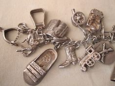 "Please see our art offerings at www.etsy.com/shop/vintageartsales Amazing vintage sterling silver link bracelet with 30 individual silver charms with jump ring connector. Unaltered collection from the 40s or 50s depicting a life which included ranching, horses, US military (Army) and travel to Mexico and Hawaii. Many rare and intricate charms with moving parts and extra detail. Most are soldered onto the bracelet with a jump ring. Measurements: Bracelet length 7.5\" Mark: 925 or Sterling on mos Vintage Antique Silver Nickel-free Charms, Vintage Nickel-free Antique Silver Charms, Vintage Silver Engraved Charm Bracelet, Vintage Nickel Free Silver Charms, Vintage Hallmarked Sterling Silver Charm Bracelet, Vintage Sterling Silver Hallmarked Charm Bracelet, Vintage Silver Charm Bracelet As Gift, Silver Vintage Charm Bracelet As Gift, Collectible Silver Vintage Charm