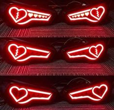 four red heart shaped lights on the side of a car