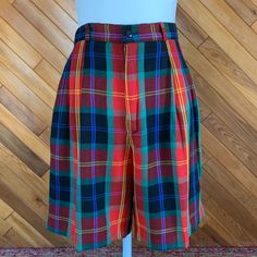 These adorable plaid shorts can be worn dressed up or down. Would be a great Christmas look with some tights.  Excellent condition.  By Rafaella Measurements taken while flat: Waist: 28" Hips: 40" Inseam:  7" Rise: 13" Fitted Plaid Shorts, Fitted Plaid High-waisted Shorts, Plaid High-waisted Fitted Shorts, Preppy Plaid Short Bottoms, Retro Plaid Short-length Bottoms, Retro Plaid Short Bottoms, Suit Shorts, Christmas Look, Plaid Suit