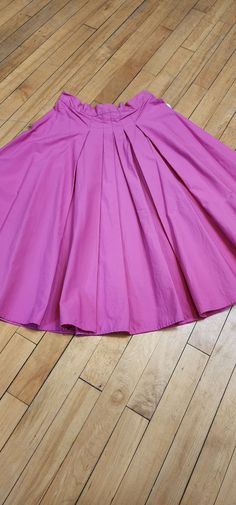 This pretty in pink skirt is made of 100% Cotton and has lovely pleated detailing in the front. It measures a 27" waist and 25.5" in length, hitting just below the knee. Handmade personally by Hollyville shop owner, Pam Pink Pleated Flowy Dress, Pink Pleated Dress With Flowy Skirt, Pink A-line Pleated Skirt, Pink Accordion Pleats Skirt, Solid Full Skirt With Pleated Hem, Pink Pleated A-line Skirt, Fitted Full Skirt With Pleated Hem, Pink Dress With Gathered Flared Skirt, Fitted Pink Midi Dress