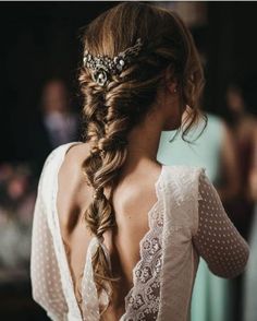 the back of a woman's head wearing a wedding hair piece