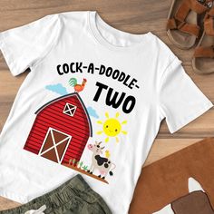 a t - shirt that says, cocka doodle two with farm animals on it