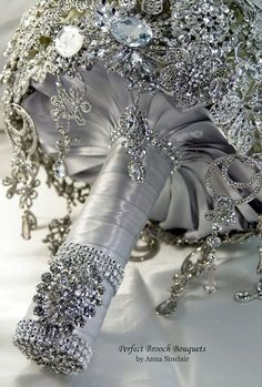 the bridal bouquet has been made with silver and crystal beads, which are accented with swaro crystals