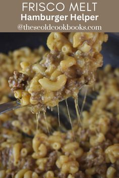 a spoon full of macaroni and cheese being lifted from a skillet with the words frisco melt hamburger helper