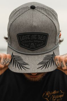 Lost at Sea Gunmetal PVC snapback. 71% of earth is covered by water; how much of your personal planet is a vast, neverending waterland? Even with limited resources and unknown dangers, you can still survive if you keep your wits and plan for the worst, representing in this life, but hoping for the best isn't enough; live a life of resourcefulness, cleverness, and resilience, even when you have no sense of direction. This custom grey water resistant 3D PVC rubber patch hat lets you proclaim your Relentless Betrayal, Hoping For The Best, Lost At Sea, Sink Or Swim, White Crop Tank, Rubber Patch, Patch Hat, Anchor Necklace, Black Snapback