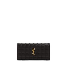 Saint Laurent wallet in quilted leather Features YSL logo lettering  Envelope flap top with snap closure  Interior, card slots and zip pocket Golden hardware  Approx. 7.4"W x 3.9"H x 1.6"D Made in Italy Ysl Logo, Saint Laurent Wallet, 6 D, Quilted Leather, Snap Closure, Card Slots, Slots, Zip Pockets, Saint Laurent