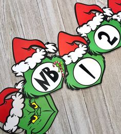 three grin face stickers with the word w b i in red, white and green