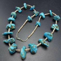 "VINTAGE NAVAJO TURQUOISE NECKLACE DESCRIPTION: This strand features hand formed beads of blue Kingman turquoise, spaced and finished with fine hand rolled shell heishi. PLEASE NOTE: One of the turquoise beads is chipped, it is at the end of the strand (see photos). This gorgeous necklace will be a valuable addition to your collection of fine vintage Native American jewelry. MEASUREMENTS: Necklace measures 25\" end to end Beads are securely strung on natural fiber WEIGHT: 104.9 grams SIGNED: no Necklace Shell, Vintage Native American Jewelry, Navajo Turquoise, Native Jewelry, Kingman Turquoise, Wedding Jewellery Necklace, Blue Jewelry, Vintage Turquoise, Shell Necklaces