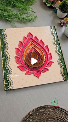 a table topped with lots of different types of paper and flowers on top of it