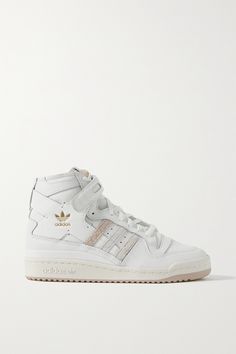 adidas Originals' 'Forum' sneakers debuted in 1984, and this latest white and beige iteration is a versatile adaptation of the original. Made from leather, they have a trio of suede stripes and the iconic VELCRO®-fastening ankle straps. Adidas High, High Top Adidas, Adidas Shoes Originals, Adidas Forum, White And Beige, Adidas Originals Women, Leather High Tops, Suede Lace, High Top Shoes