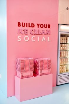 pink ice cream display with baskets in front of it