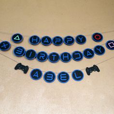 a birthday banner with video game controllers on it