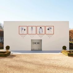 the entrance to dior's new showroom is shown in front of a white building