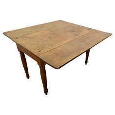 an old wooden table with two legs and a square top on the bottom, against a white background