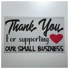 a sign that says thank you for supporting our small business with a heart on it