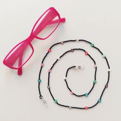 Crochet Eyewear Retainer / Eyeglass Chain / Eyeglass Strap / Glasses Chain for Women / Glasses Lanyard / Reading Glasses Chain You can use this flowered eyeglass chain on your reading glasses, prescription glasses or summer sunglasses. The eyeglass holder chain is lightweight and measures approx 30". RETURN/EXCHANGE If you don't LOVE it, I'll reimburse or exchange an unworn / unused item. Please contact me if you have any issues or questions. Thank you very much for visiting my store. I hope you Glass Glasses Chains With Colorful Beads For Gifts, Gift Glasses Chains With Colorful Glass Beads, Gift Colorful Glass Beads Glasses Chains, Multicolor Adjustable Glasses Chains For Gift, Summer Gift Black Glasses Chains, Trendy Multicolor Glasses Chains As Gift, Bohemian Black Glasses Chains As Gift, Daisy Bead Necklace, Flower Glasses