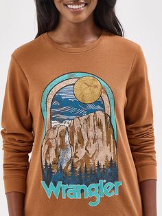 Bring a little bit of the Wild West wherever you go wearing our Women’s Long Sleeve Thermal Graphic Tee. It features a regular fit that’s a classic for a reason, cut straight from the sleeves to hip. This thermal crewneck shirt is crafted from cotton in a waffle knit for extra comfort when cooler days arrive. It features a retro-inspired graphic print full of Western iconography. Wrangler Women, The Wild West, Crew Neck Shirt, Graphic Tees Women, Wild West, Waffle Knit, Women's Tops, Retro Inspired, Graphic Prints