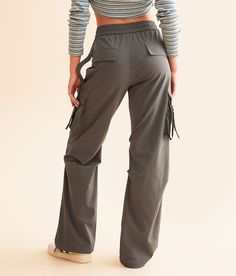 Vibrant M.I.U. Cargo Stretch Pant - Grey Medium, Women's Grey Elasticized cinch tie waistband pant Rise measures 11 1/2 30 inseam Faux flap back pockets Cinch tie bottom openings. 90% Nylon 10% Spandex. Hand wash cold water inside out. Do not bleach. Do not tumble dry. Do not iron. Apparel & Accessories > Clothing > Pants Fall Utility Sweatpants With Elastic Waistband, Utility Pants With Belt Loops For Fall, Utility Straight Leg Pants With Drawstring, Fitted Full-length Cargo Pants With Elastic Waistband, Utility Pants With Drawstring For Fall, Loosely Fitted Cargo Pants With Belt Loops For Fall, Fall Fitted Parachute Pants With Pockets, Fall Utility Pants With Drawstring, Utility Bottoms With Drawstring And Loose Fit