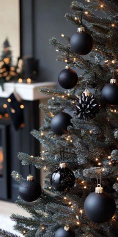 a christmas tree with black and silver ornaments