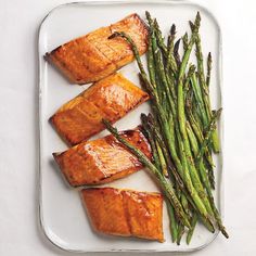 salmon and asparagus on a white plate